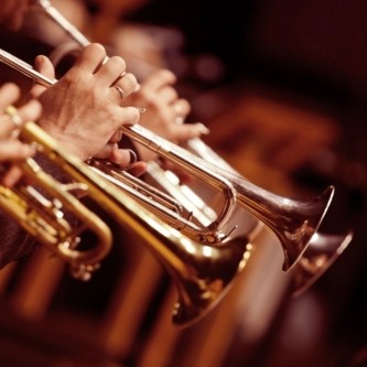 Brass section playing trumpets